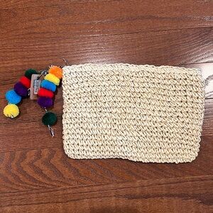 Woven clutch with Pom Pom zipper pull